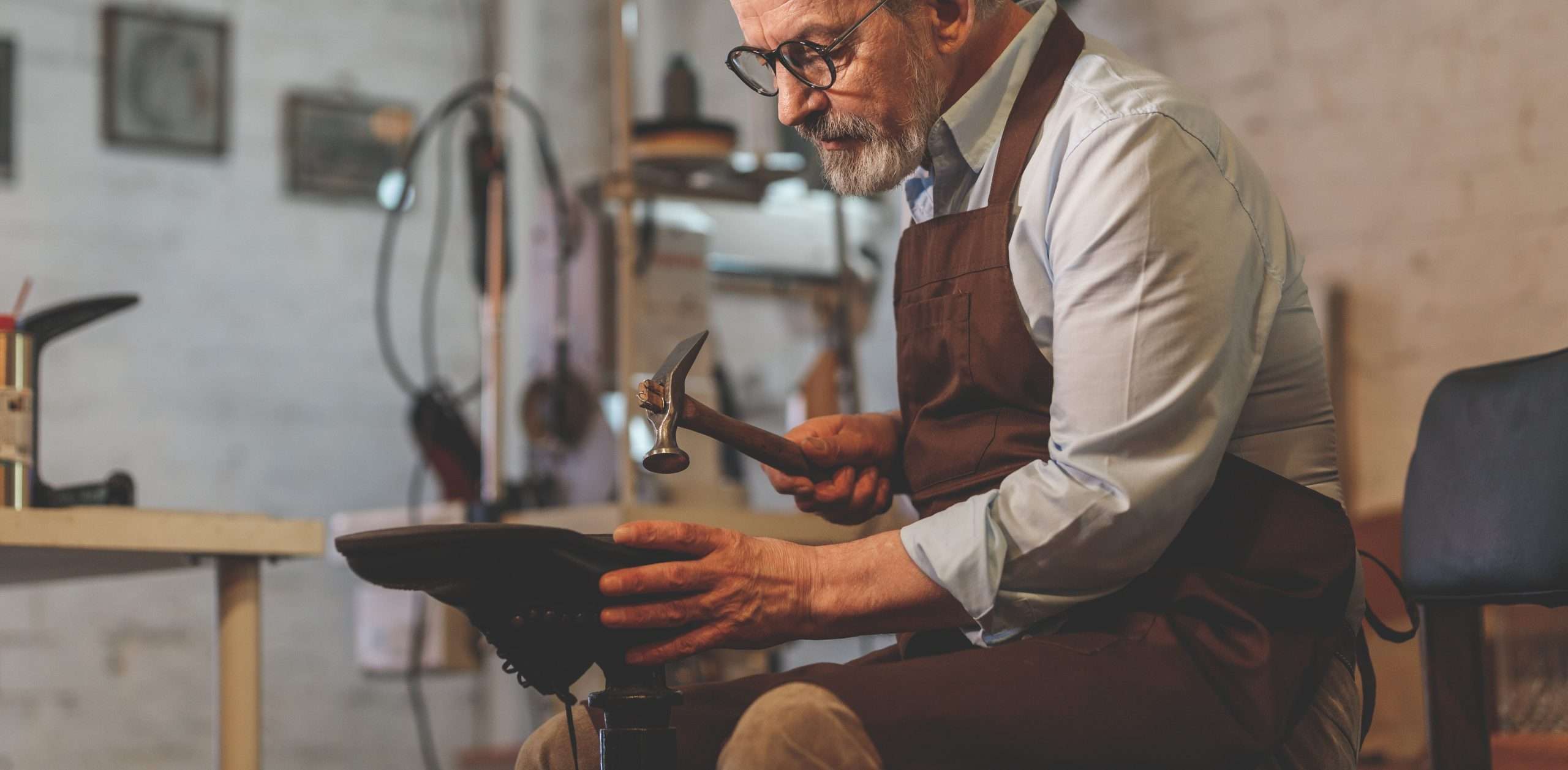 An elderly man at work in the workshop